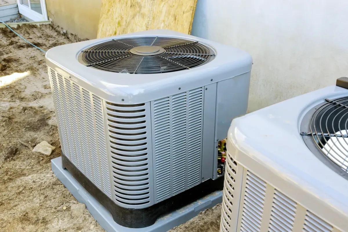 Two outdoor air conditioner condensers