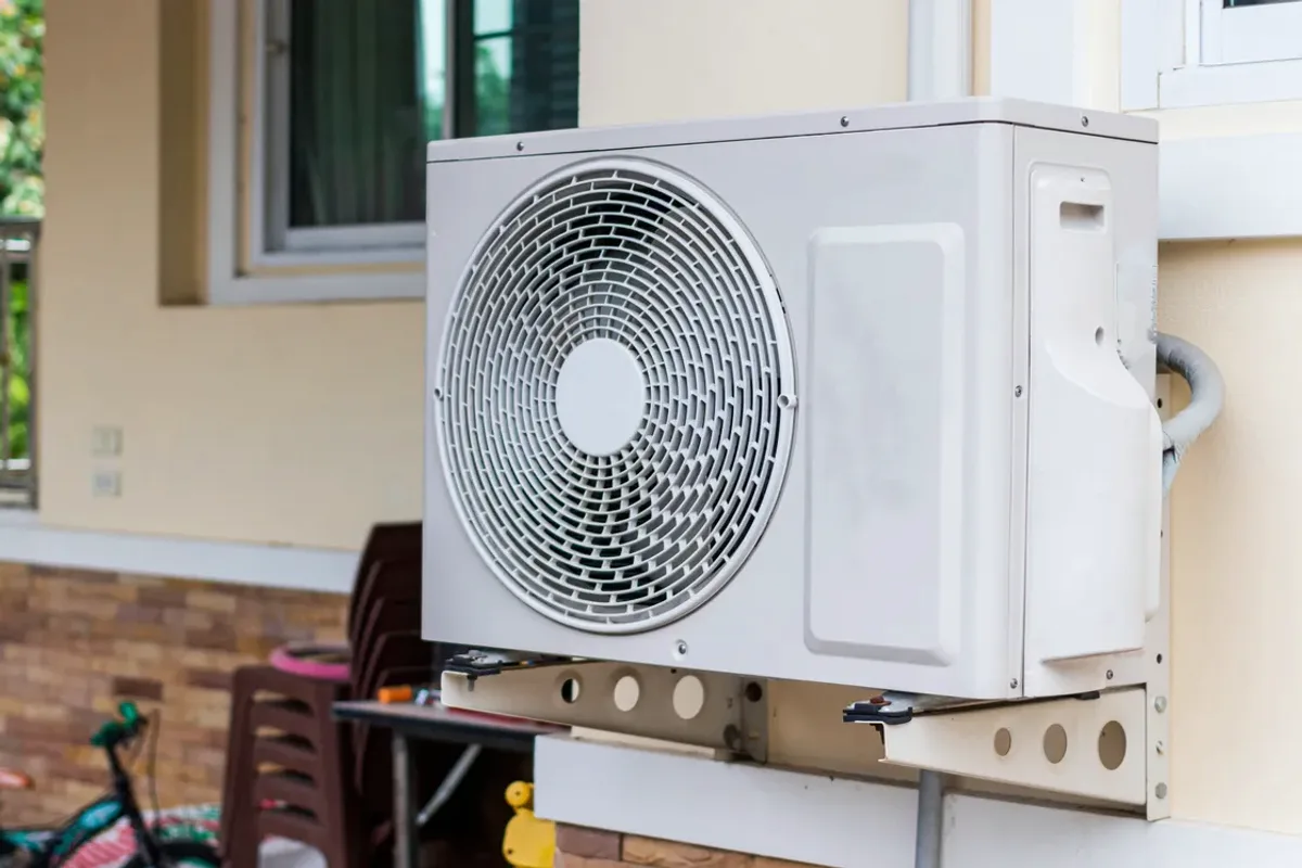 Outdoor heat pump unit on a wall bracket